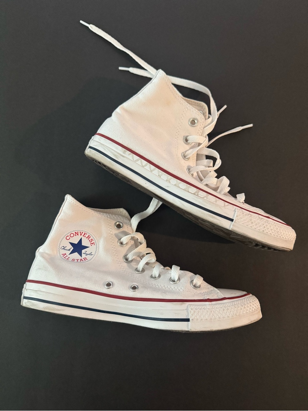 Woman’s high top converse
